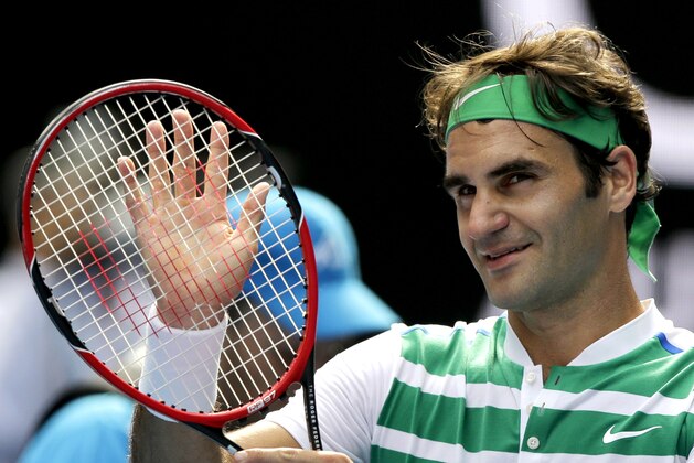 Roger Federer of Switzerland celebrates after defeating Tomas Berdych of the Czech Republic in their quarterfinal match at the Australian Open tennis championships in Melbourne, Australia, Tuesday, Jan. 26, 2016.(AP Photo/Aaron Favila)