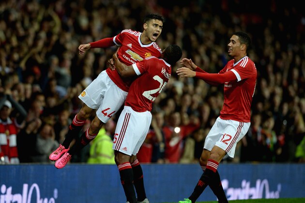 MANCHESTER, ENGLAND - SEPTEMBER 23:  Andreas Pereira of Manchester United celebrates with Antonio Valencia after scoring his team's second goal during the Capital One Cup Third Round match between Manchester United and Ipswich Town at Old Trafford on September 23, 2015 in Manchester, England.  (Photo by Gareth Copley/Getty Images)