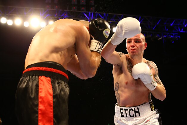 SHEFFIELD, ENGLAND - MARCH 28:  Adam Etches (R) of Great Britain fights Sergei Khomitsky (L) of Belarus during the IBF international middleweight championship fight at Motorpoint Arena on March 28, 2015 in Sheffield, England.  (Photo by Richard Heathcote/Getty Images)