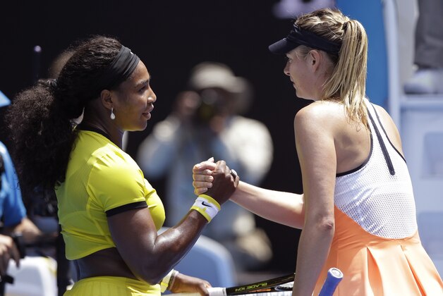 Serena Williams, left, of the United States is congratulated by Maria Sharapova of Russia after winning their quarterfinal match at the Australian Open tennis championships in Melbourne, Australia, Tuesday, Jan. 26, 2016.(AP Photo/Aaron Favila)