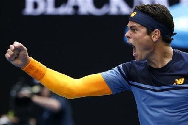 Milos Raonic of Canada celebrates after defeating Stan Wawrinka of Switzerland during their fourth round match at the Australian Open tennis championships in Melbourne, Australia, Monday, Jan. 25, 2016.(AP Photo/Vincent Thian)