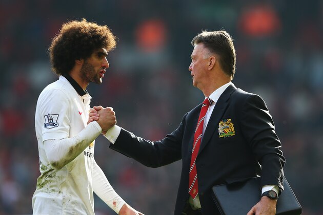 LIVERPOOL, ENGLAND - MARCH 22:  Louis van Gaal, manager of Manchester United celebrates with Marouane Fellaini of Manchester United after the Barclays Premier League match between Liverpool and Manchester United at Anfield on March 22, 2015 in Liverpool, England.  (Photo by Alex Livesey/Getty Images)
