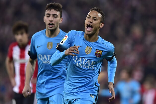FC Barcelona's Neymar of Brazil, right, celebrates his goal beside Munir El Haddadi, after scoring  during their Spanish Copa del Rey soccer match, round 8, first leg, between Athletic Bilbao and FC Barcelona, at San Mames stadium, in Bilbao northern Spain, Wednesday, Jan. 20 2016. (AP Photo/Alvaro Barrientos)