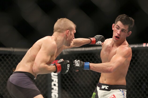 Dominick Cruz evades a punch against TJ Dillashaw in their mixed martial arts title bout at UFC Fight Night 81, Sunday, Jan. 17, 2016, in Boston.  Cruz won via split decision and is the new UFC Bantamweight Champion.  (AP Photo/Gregory Payan)