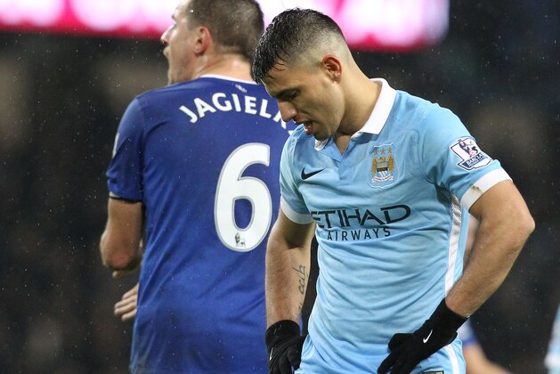 Manchester City's Argentinian striker Sergio Aguero reacts after missing a shot on goal during the English Premier League football match between Manchester City and Everton at the Etihad stadium in Manchester, north west England on January 13, 2016.
AFP PHOTO / LINDSEY PARNABY
RESTRICTED TO EDITORIAL USE. NO USE WITH UNAUTHORIZED AUDIO, VIDEO, DATA, FIXTURE LISTS, CLUB/LEAGUE LOGOS OR 'LIVE' SERVICES. ONLINE IN-MATCH USE LIMITED TO 75 IMAGES, NO VIDEO EMULATION. NO USE IN BETTING, GAMES OR SINGLE CLUB/LEAGUE/PLAYER PUBLICATIONS. / AFP / LINDSEY PARNABY        (Photo credit should read LINDSEY PARNABY/AFP/Getty Images)