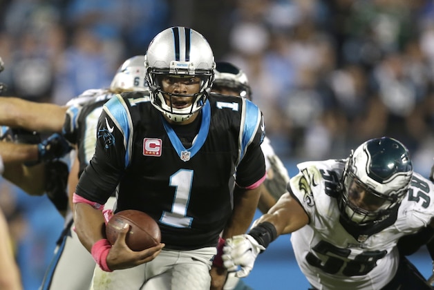 Carolina Panthers' Cam Newton (1) runs as Philadelphia Eagles' Jordan Hicks (58) defends in the second half of an NFL football game in Charlotte, N.C., Sunday, Oct. 25, 2015. (AP Photo/Bob Leverone)