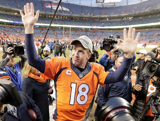 Denver Broncos quarterback Peyton Manning waves to spectators following the NFL football AFC Championship game between the Denver Broncos and the New England Patriots, Sunday, Jan. 24, 2016, in Denver. The Broncos defeated the Patriots 20-18 to advance to the Super Bowl. (AP Photo/Charlie Riedel)