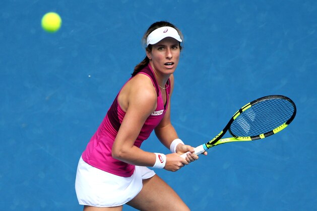 Johanna Konta of Britain looks to play a backhand return to Zhang Shuai of China during their quarterfinal match at the Australian Open tennis championships in Melbourne, Australia, Wednesday, Jan. 27, 2016.(AP Photo/Rick Rycroft)