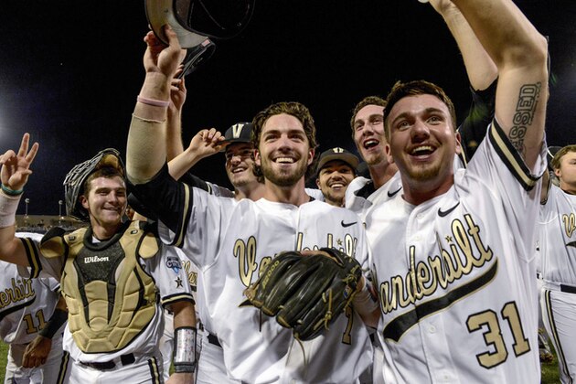 Vanderbilt shortstop Dansby Swanson, center, pitcher Ryan Johnson (31), catcher Jason Delay, left, and others acknowledge supporters following an NCAA College World Series baseball game against TCU at TD Ameritrade Park in Omaha, Neb., Friday, June 19, 2015. Vanderbilt defeated TCU 7-1 and advances to the championship series. (AP Photo/Mike Theiler)