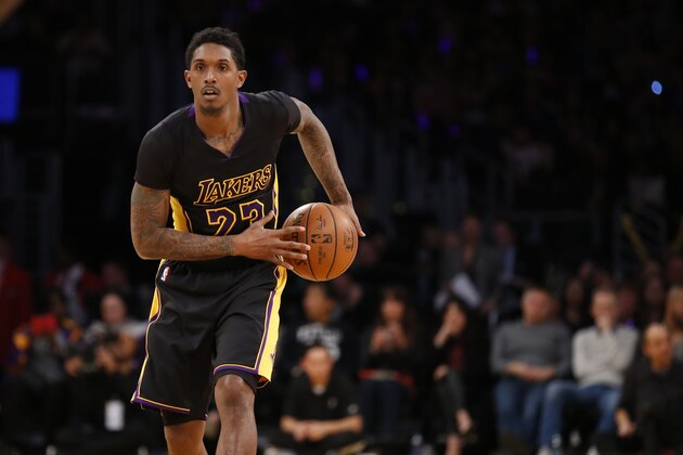 Los Angeles Lakers' Lou Williams controls the ball against the Philadelphia 76ers during the second half of an NBA basketball game, Friday, Jan. 1, 2016, in Los Angeles. The Lakers won 93-84. (AP Photo/Danny Moloshok)