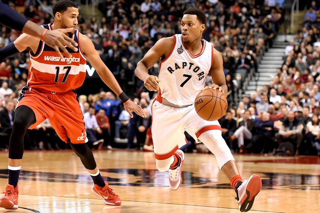 Jan 26, 2016; Toronto, Ontario, CAN;  Toronto Raptors guard Kyle Lowry (7) dribbles past Washington Wizards guard Garrett Temple (17) in the second half at Air Canada Centre. The Raptors won 106-89. Mandatory Credit: Dan Hamilton-USA TODAY Sports