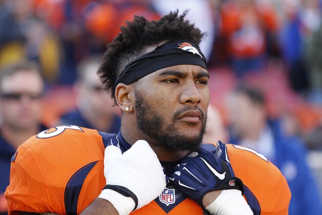 Denver Broncos strong safety T.J. Ward looks on before the start of an NFL football game against the San Diego Chargers, Sunday, Jan. 3, 2016, in Denver. (AP Photo/Jack Dempsey)