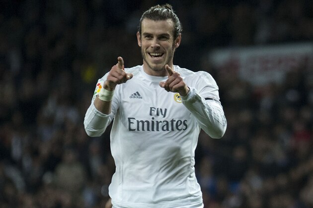 Real Madrid's Welsh forward Gareth Bale celebrates a goal during the Spanish league football match Real Madrid CF vs RC Deportivo de la Coruna at the Santiago Bernabeu stadium in Madrid on January 9, 2016.   AFP PHOTO / GONZALO ARROYO / AFP / GONZALO ARROYO        (Photo credit should read GONZALO ARROYO/AFP/Getty Images)