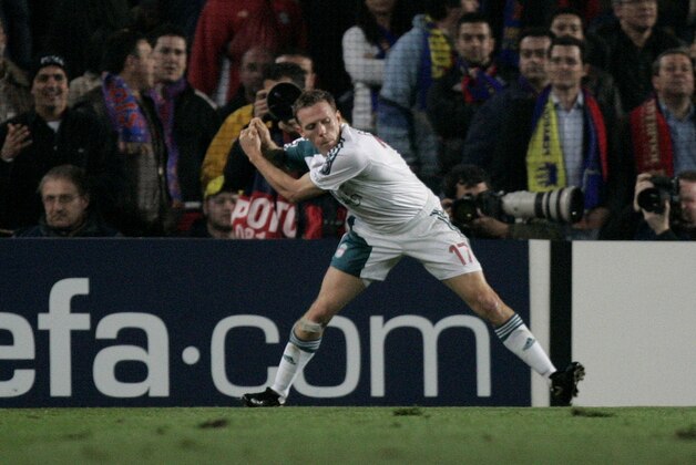 Liverpools's Craig Bellamy celebrates scoring a goal against  Barcelona by pretending to swing a golf club in the Champions League first knockout round, first-leg soccer match. at the Camp Nou Stadium, Barcelona, Spain, Wednesday Feb. 21, 2007.  The gesture appears to be a reference to claims  that Bellamy allegedly hit  team mate John Arne Riise in the legs with a golf club in a fracas while Liverpool was in Portugal at a training camp preparing for a Champions League match against defending champion FC Barcelona.  Bellamy now faces a fine of 80,000 pounds (US$155,000; 118,000) and an uncertain future with the 18-time English league champions, who were recently taken over by a pair of American businessmen.  (AP Photo/Dave Thompson)
