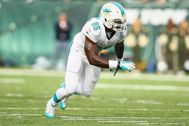 EAST RUTHERFORD, NJ - DECEMBER 01:   Dion Jordan #95 of the Miami Dolphins in action against the New York Jets during their game at MetLife Stadium on December 1, 2013 in East Rutherford, New Jersey.  (Photo by Al Bello/Getty Images)
