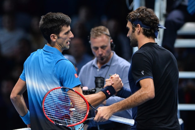Switzerland's Roger Federer (R) greets Serbia's Novak Djokovic after losing the men's singles final match against Switzerland's Roger Federer on day eight of the ATP World Tour Finals tennis tournament in London on November 22, 2015. 
AFP PHOTO / GLYN KIRK        (Photo credit should read GLYN KIRK/AFP/Getty Images)