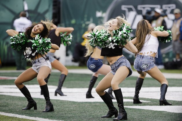 New York Jets cheerleaders perform during the first half of an NFL football game against the New England Patriots Sunday, Dec. 27, 2015, in East Rutherford, N.J. (AP Photo/Seth Wenig)