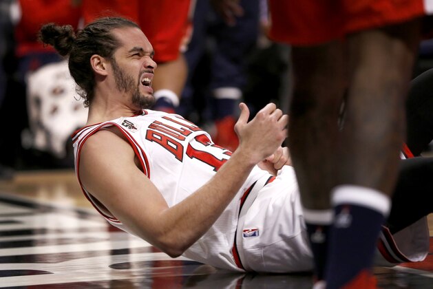 Chicago Bulls center Joakim Noah gets up off the floor after falling on his left shoulder during the second half of an NBA basketball game against the Washington Wizards, Monday, Jan. 11, 2016, in Chicago. Noah returned from a shoulder injury on Monday night against Washington, providing another option for coach Fred Hoiberg heading into a busy stretch. Noah sprained his left shoulder during a loss to Brooklyn on Dec. 21. (AP Photo/Charles Rex Arbogast)