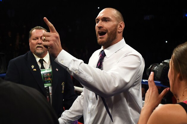WBA title holder and rival Tyson Fury of Britain challeges Deontay Wilder of the US (out of frame) after Wilder defeated Artur Szpilka of Poland in their WBC Heavyweight Championship bout at Barclay's Center in Brooklyn, New York, on January 16, 2016. 
Wilder knocked out Szpilka in the ninth round.  / AFP / AFP PHOTO / DON EMMERT        (Photo credit should read DON EMMERT/AFP/Getty Images)