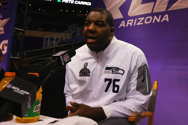 PHOENIX, AZ - JANUARY 27: Russell Okung #76 of the Seattle Seahawks addresses the media at Super Bowl XLIX Media Day Fueled by Gatorade inside U.S. Airways Center on January 27, 2015 in Phoenix, Arizona. (Photo by Elsa/Getty Images) PHOENIX, AZ - JANUARY 27: Russell Okung #76 of the Seattle Seahawks addresses the media at Super Bowl XLIX Media Day Fueled by Gatorade inside U.S. Airways Center on January 27, 2015 in Phoenix, Arizona. (Photo by Elsa/Getty Images)
