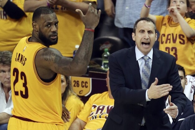 FILE - In this May 24, 2015, file photo, Cleveland Cavaliers head coach David Blatt yells at his team as LeBron James (23) looks on during overtime of Game 3 of the Eastern Conference finals of the NBA basketball playoffs against the Atlanta Hawks in Cleveland. Blatt was handed a star-studded team expected to win an NBA title, but not a handbook on how to get the Cavaliers to the top. For Blatt, who left his family in Israel to pursue his dream, the journey has been difficult with speculation about his future partly undermining his success. (AP Photo/Ron Schwane, File)