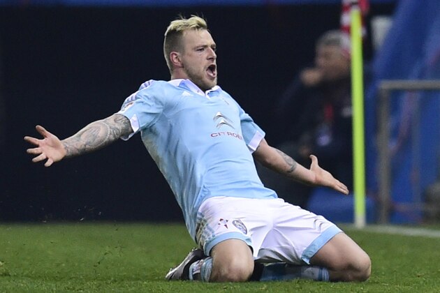 Celta Vigo's Swedish forward John Guidetti celebrates after scoring a goal during the Spanish Copa del Rey (King's Cup) quarterfinal second leg football match Club Atletico de Madrid vs RC Celta de Vigo at the Vicente Calderon stadium in Madrid on January 27, 2016.   AFP PHOTO/ JAVIER SORIANO / AFP / JAVIER SORIANO        (Photo credit should read JAVIER SORIANO/AFP/Getty Images)