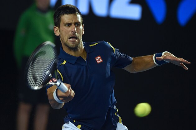 Serbia's Novak Djokovic plays a forehand return during his men's singles match against Japan's Kei Nishikori on day nine of the 2016 Australian Open tennis tournament in Melbourne on January 26, 2016. AFP PHOTO / PAUL CROCK-- IMAGE RESTRICTED TO EDITORIAL USE - STRICTLY NO COMMERCIAL USE / AFP / PAUL CROCK        (Photo credit should read PAUL CROCK/AFP/Getty Images)