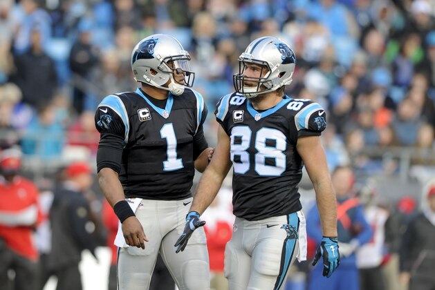 Carolina Panthers quarterback Cam Newton (1) talks to tight end Greg Olsen (88) during the first half of a NFL football game against the Tampa Bay Buccaneers in Charlotte, N.C. Sunday, Jan. 3, 2016. (AP Photo/Mike McCarn)