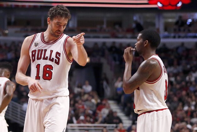 Chicago Bulls center Pau Gasol coaches guard Aaron Brooks during the second half of an NBA basketball game against the Miami Heat Monday, Jan. 25, 2016, in Chicago. The Heat won 89-84. (AP Photo/Charles Rex Arbogast)