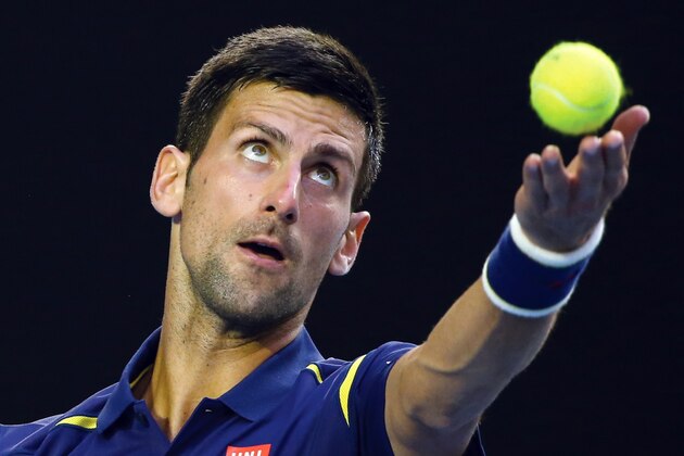 Novak Djokovic of Serbia serves to Kei Nishikori of Japan during their quarterfinal match at the Australian Open tennis championships in Melbourne, Australia, Tuesday, Jan. 26, 2016.(AP Photo/Rick Rycroft)