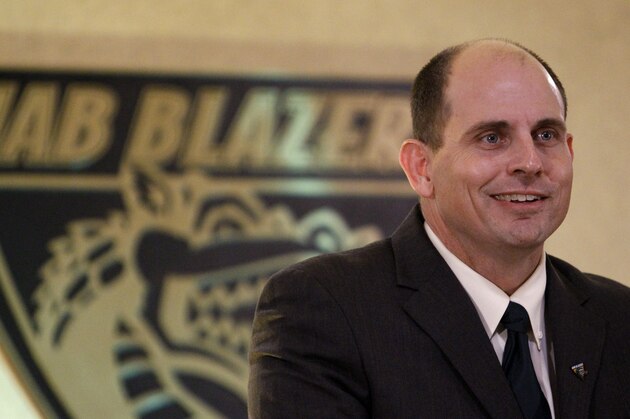 Bill Clark talks to reporters after he was introduced as UAB football coach Wednesday, Jan. 22, 2014, in Birmingham, Ala. Clark led Jacksonville State to its most victories since the Gamecocks' Division II champion team in 1992 during his lone season. Jacksonville State went 11-4 and advanced to the FCS quarterfinals. (AP Photo/Butch Dill)