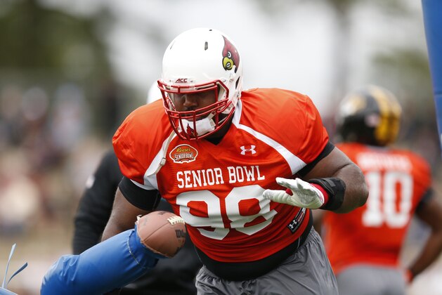 Louisville defensive end Sheldon Rankins (98) runs through drills during NCAA college football practice for the Senior Bowl, Tuesday, Jan. 26, 2016, at Fairhope Municipal Stadium, in Fairhope, Ala.(AP Photo/Brynn Anderson)