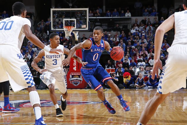 INDIANAPOLIS, IN - NOVEMBER 18: Frank Mason III #0 of the Kansas Jayhawks handles the ball against Tyler Ulis #3 of the Kentucky Wildcats during the State Farm Champions Classic at Bankers Life Fieldhouse on November 18, 2014 in Indianapolis, Indiana. Kentucky defeated Kansas 72-40. (Photo by Joe Robbins/Getty Images)