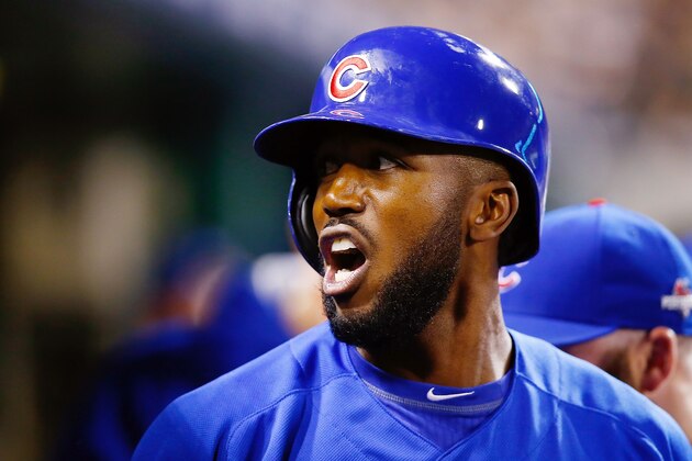 PITTSBURGH, PA - OCTOBER 07:  Dexter Fowler #24 of the Chicago Cubs reacts in the dugout after scoring a run on an RBI single by Kyle Schwarber #12 of the Chicago Cubs (not pictured) in the first inning during the National League Wild Card game against the Pittsburgh Pirates at PNC Park on October 7, 2015 in Pittsburgh, Pennsylvania.  (Photo by Jared Wickerham/Getty Images)