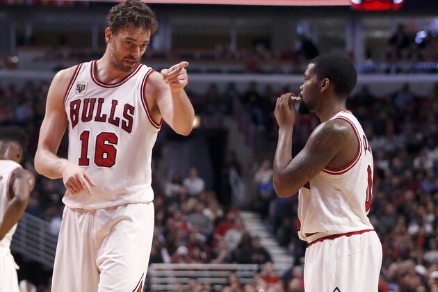 Chicago Bulls center Pau Gasol coaches guard Aaron Brooks during the second half of an NBA basketball game against the Miami Heat Monday, Jan. 25, 2016, in Chicago. The Heat won 89-84. (AP Photo/Charles Rex Arbogast)