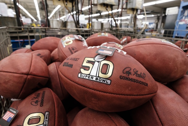 Official balls for the NFL Super Bowl 50 football game are seen in a bin prior to final inspection at the Wilson Sporting Goods Co. in Ada, Ohio, Tuesday, Jan. 26, 2016. The Denver Broncos will play the Carolina Panthers in the Super Bowl on Feb. 7 in Santa Clara, CA. (AP Photo/Rick Osentoski)