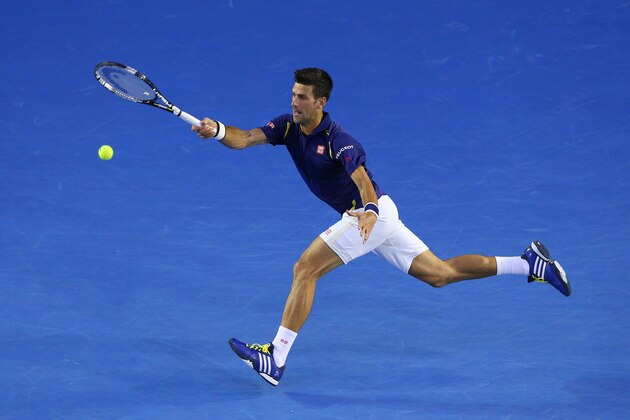 MELBOURNE, AUSTRALIA - JANUARY 28:  Novak Djokovic of Serbia plays a forehand in his semi final match against Roger Federer of Switzerland during day 11 of the 2016 Australian Open at Melbourne Park on January 28, 2016 in Melbourne, Australia.  (Photo by Cameron Spencer/Getty Images)