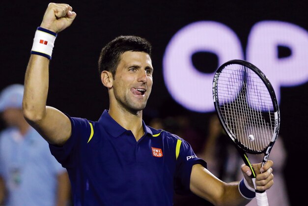 Novak Djokovic of Serbia celebrates after defeating Roger Federer of Switzerland in their semifinal match at the Australian Open tennis championships in Melbourne, Australia, Thursday, Jan. 28, 2016.(AP Photo/Aaron Favila)