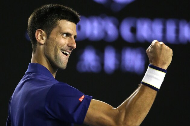 Novak Djokovic of Serbia celebrates after defeating Roger Federer of Switzerland in their semifinal match at the Australian Open tennis championships in Melbourne, Australia, Thursday, Jan. 28, 2016.(AP Photo/Rick Rycroft)