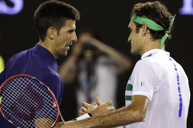 Novak Djokovic, left,  of Serbia is congratulated by Roger Federer of Switzerland after their semifinal match at the Australian Open tennis championships in Melbourne, Australia, Thursday, Jan. 28, 2016.(AP Photo/Aaron Favila)
