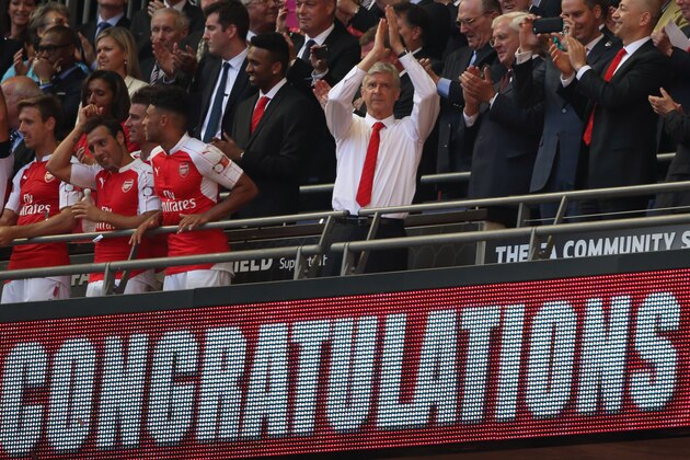 LONDON, ENGLAND -  AUGUST 2: Manager Arsene Wenger of Arsenal applauds the fans as his team lift  the FA Community Shield trophy after the FA Community Shield match between Chelsea and Arsenal at Wembley Stadium on August 2, 2015 in London, England.  (Photo by Matthew Ashton - AMA/Getty Images)
