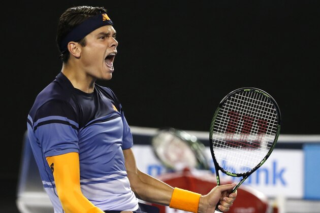 Milos Raonic of Canada celebrates after defeating Gael Monfils of France in their quarterfinal match at the Australian Open tennis championships in Melbourne, Australia, Wednesday, Jan. 27, 2016.(AP Photo/Vincent Thian)