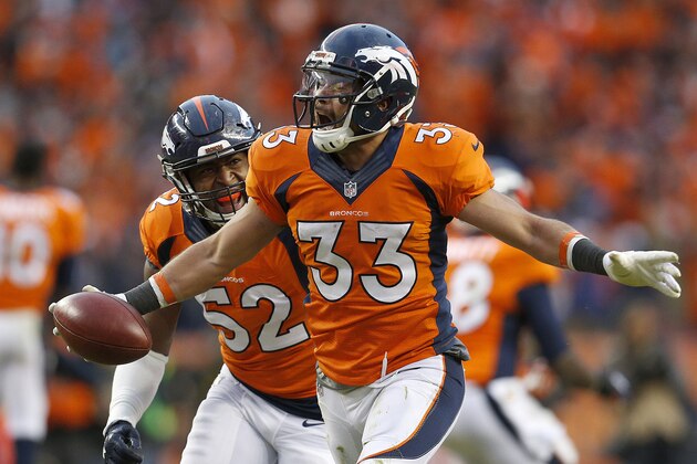 Denver Broncos defensive back Shiloh Keo (33) celebrates with Corey Nelson following the AFC Championship game between the Denver Broncos and the New England Patriots, Sunday, Jan. 24, 2016, in Denver. The Broncos defeated the Patriots 20-18 to advance to the Super Bowl. (AP Photo/Joe Mahoney)