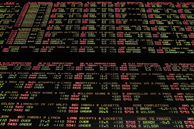 FILE- In this Jan. 27, 2015, file photo, Super Bowl proposition bets are displayed on a board at the Westgate Superbook race and sports book in Las Vegas. A new Nevada law allows investors looking for a stock market alternative to wager their money in the state on sports instead. (AP Photo/John Locher, File) FILE- In this Jan. 27, 2015, file photo, Super Bowl proposition bets are displayed on a board at the Westgate Superbook race and sports book in Las Vegas. A new Nevada law allows investors looking for a stock market alternative to wager their money in the state on sports instead. (AP Photo/John Locher, File)