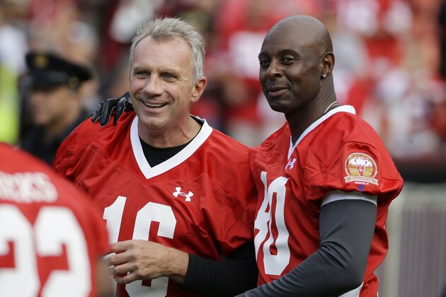Hall of Famers Joe Montana, and Jerry Rice, right, talk during warm ups before the