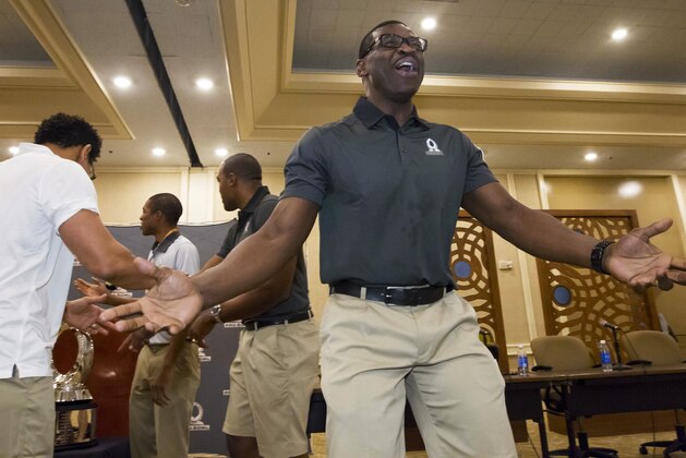 Michael Irvin, captain of Team Irvin reacts after losing the coin toss to Team Rice for the first pick of the NFL football Pro Bowl draft, during a news conference Tuesday, Jan. 26, 2016, in Kahuku, Hawaii. (AP Photo/Eugene Tanner)