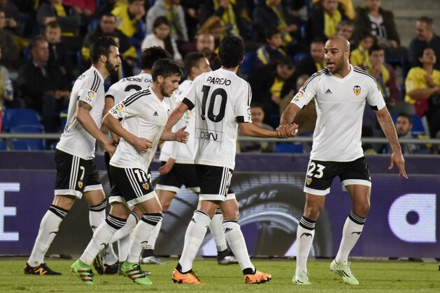 Valencia players celebrate after scoring during the Spanish Copa del Rey (King's Cup) football match UD Las Palmas vs Valencia CF at the Estadio de Gran Canaria in Las Palmas de Gran Canaria on January 28, 2016.  AFP PHOTO / DESIREE MARTIN / AFP / DESIREE MARTIN        (Photo credit should read DESIREE MARTIN/AFP/Getty Images)