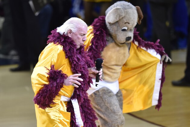Jun 11, 2015; Cleveland, OH, USA; Ric Flair performs with the Cleveland Cavaliers mascot during the first quarter of game four of the NBA Finals against the Golden State Warriors at Quicken Loans Arena. Mandatory Credit: David Richard-USA TODAY Sports