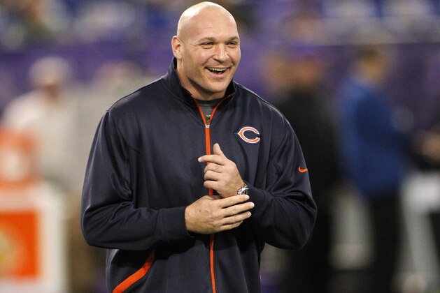 Injured Chicago Bears linebacker Brian Urlacher shares a laugh before an NFL football game against the Minnesota Vikings Sunday, Dec. 9, 2012, in Minneapolis. (AP Photo/Andy King)