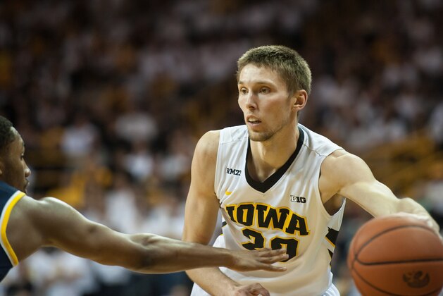 Jan 17, 2016; Iowa City, IA, USA; Iowa Hawkeyes forward Jarrod Uthoff (20) passes the ball during the second half against the Michigan Wolverines at Carver-Hawkeye Arena. Iowa won 82-71. Mandatory Credit: Jeffrey Becker-USA TODAY Sports